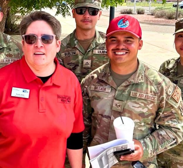 a group of volunteers smile